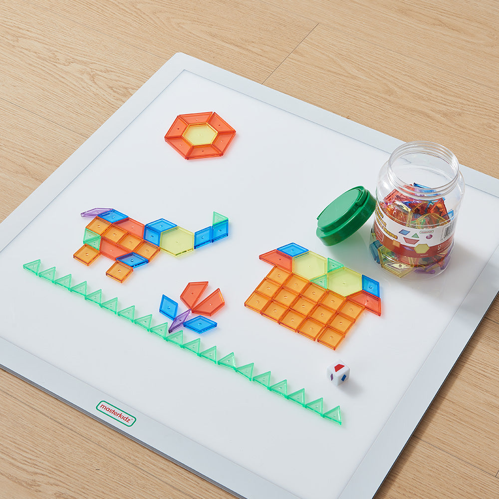 Early math shapes arranged in symmetry on a tabletop