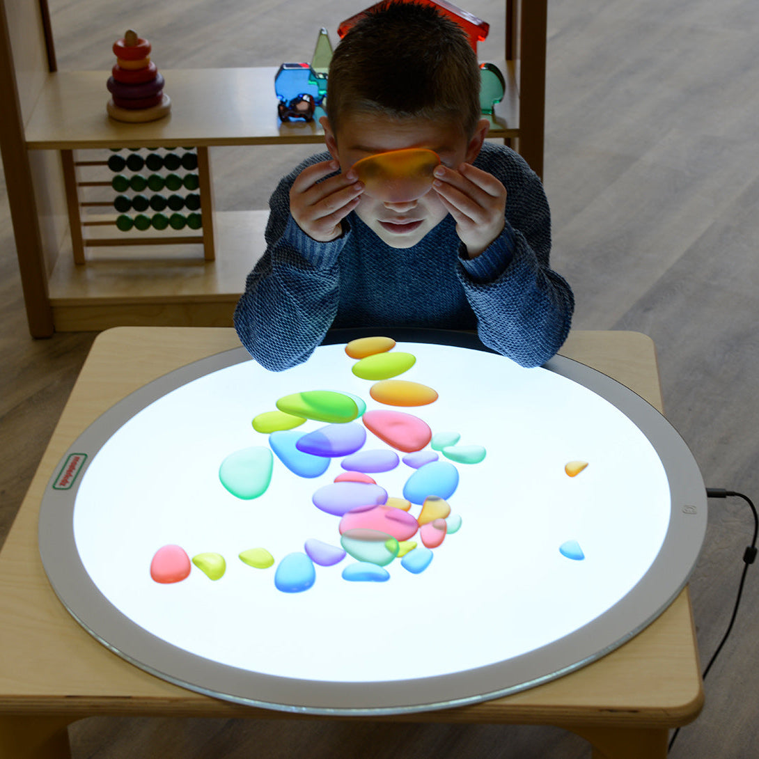 Colourful tactile pebbles in six vibrant translucent colours