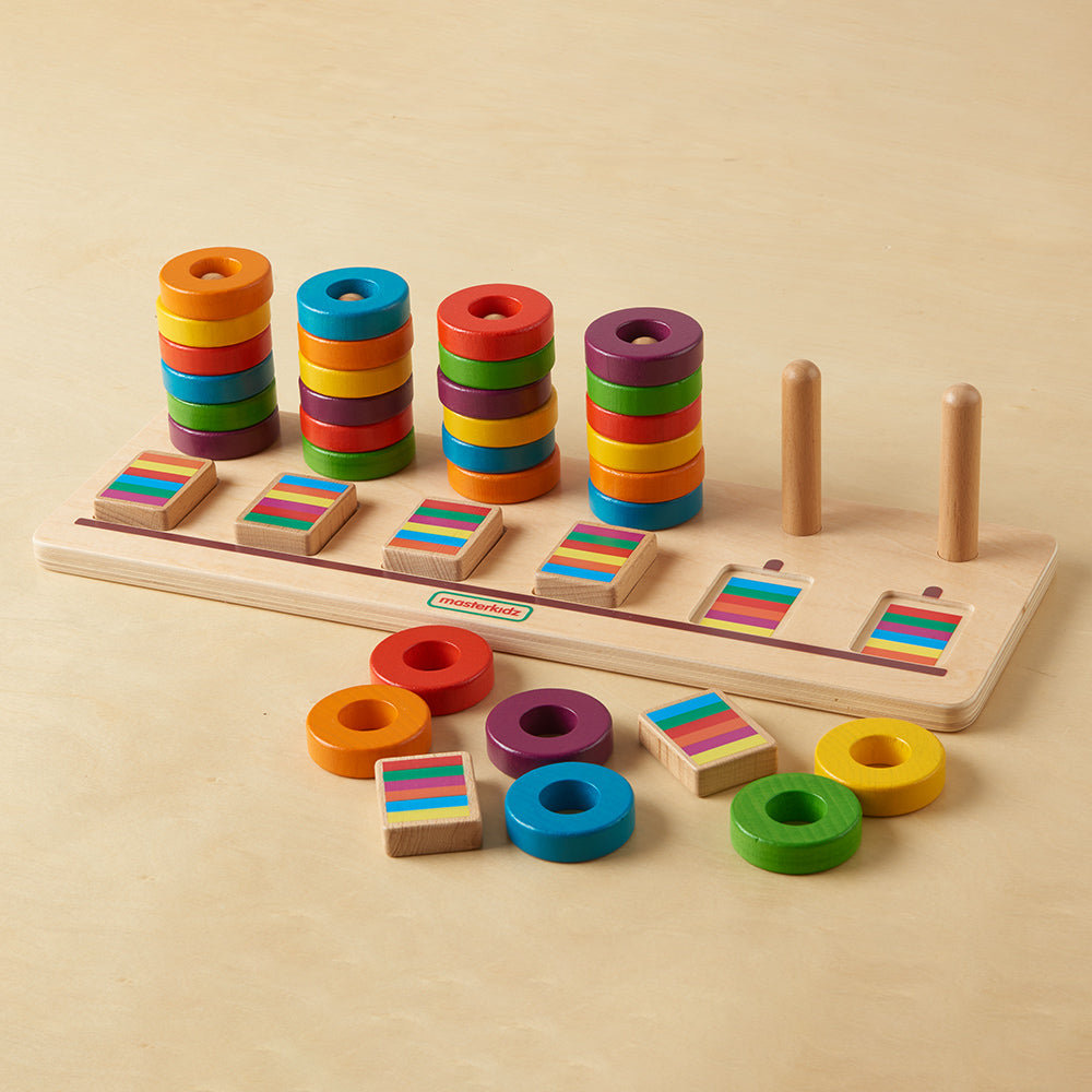 Masterkidz educational toy with 6 sets of coloured rings for sorting and stacking.
