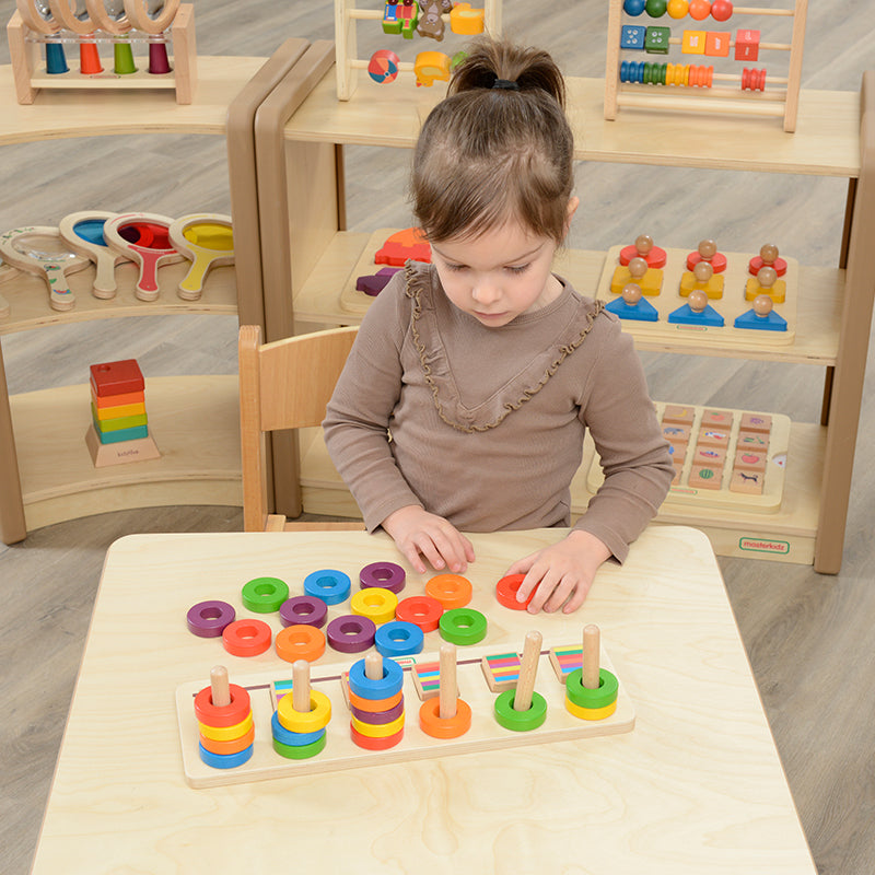 Preschool toy for sorting and sequencing colourful rings on stacking rods.