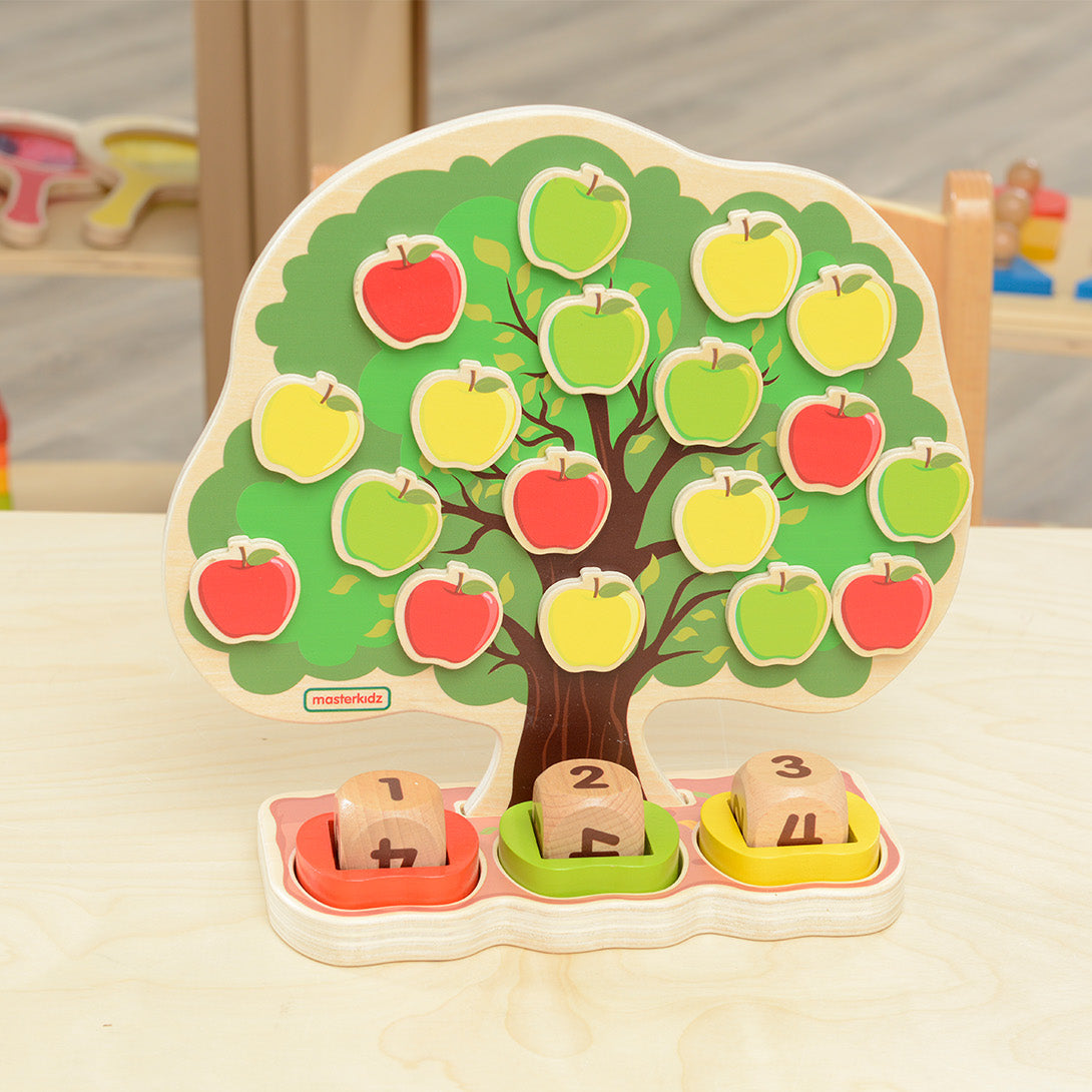 Children practicing addition by adding apples based on dice rolls.