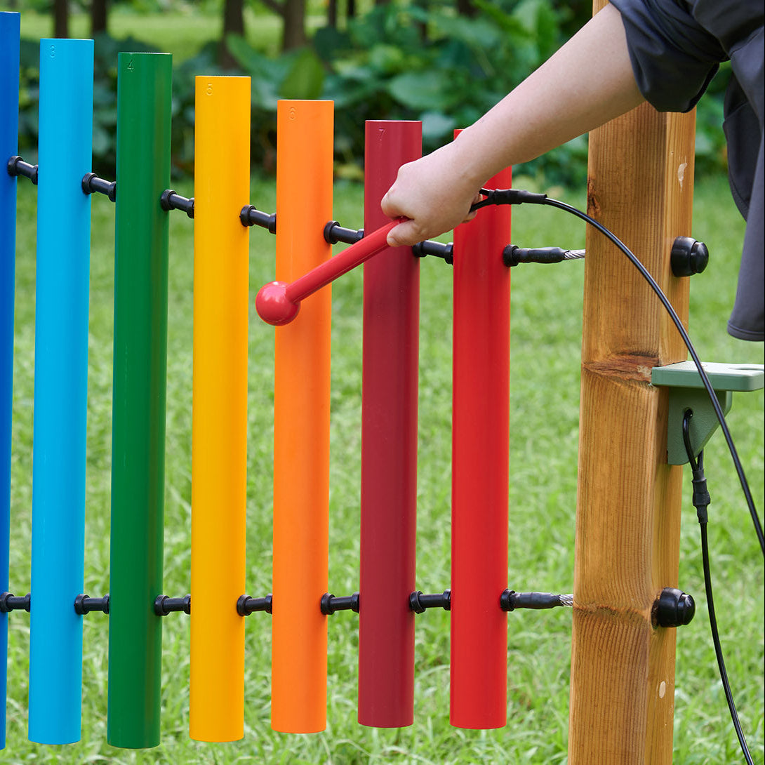 Close-up of tuned and labelled aluminium tubes forming a full C scale.