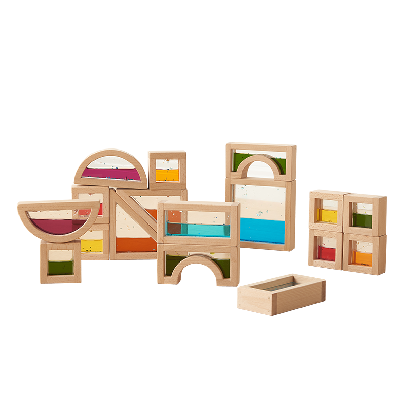 Children creating patterns and sequences with the liquid blocks on a classroom table.