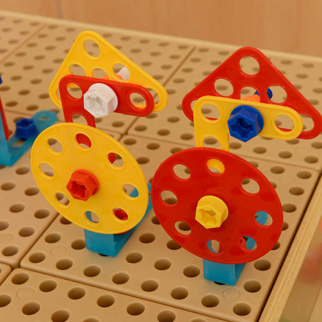 Constructive learning with mathematical concepts like symmetry, shapes, and orientation.