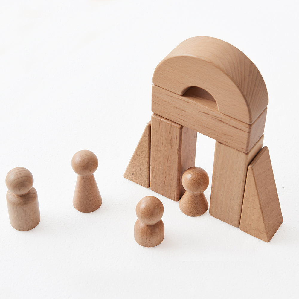 Beech wood blocks featuring turrets, pillars and domes laid out ready for construction play.