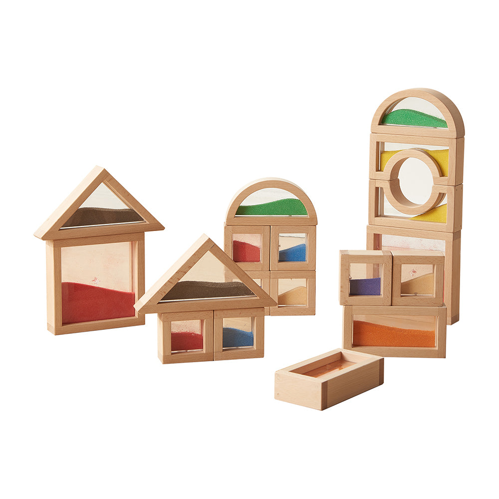 Children stacking different shapes to create colourful patterns.