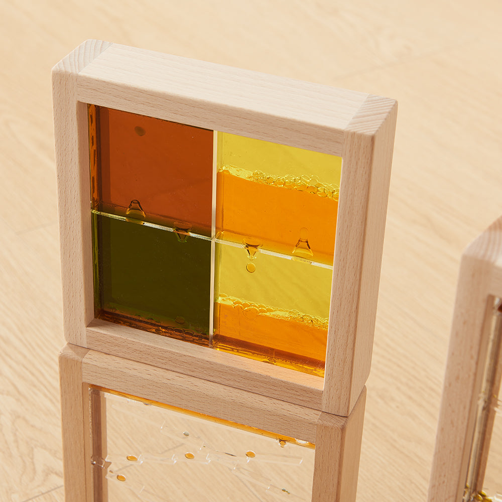 Stacked sensory bubble blocks forming a bright construction tower.