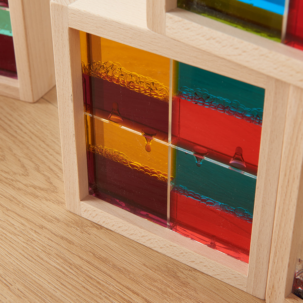 Teacher using blocks for a gravity and motion demonstration in class.