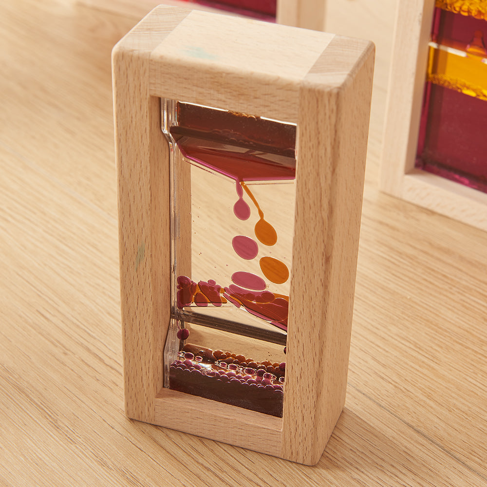 Close-up of shimmering liquids separating and merging inside the blocks.