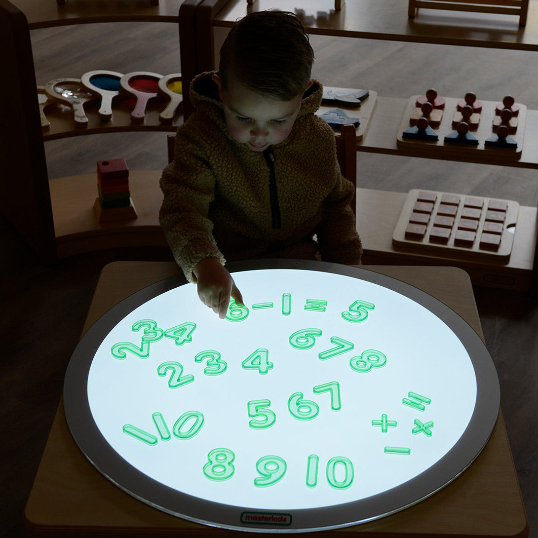 Plus, minus and equals symbols laid out for simple addition and subtraction practice.