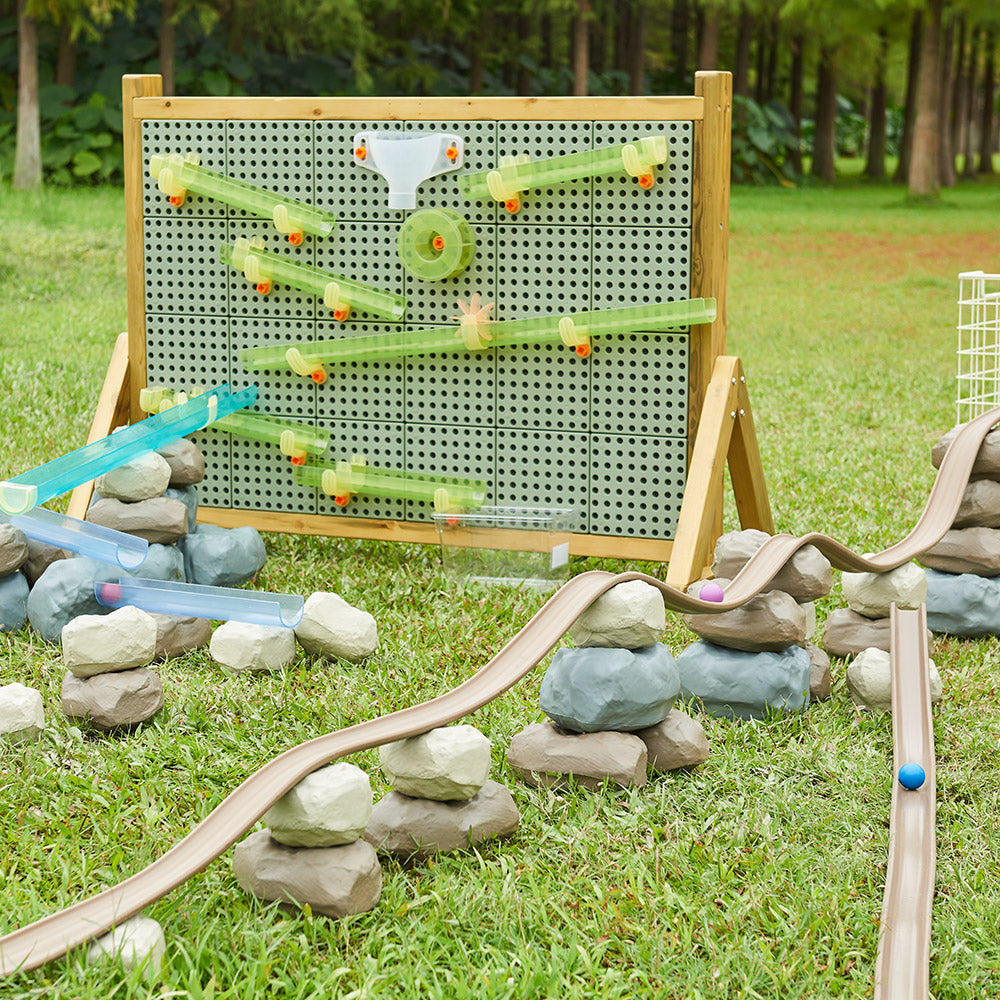Water flowing down the soft track placed on a sloped classroom table.