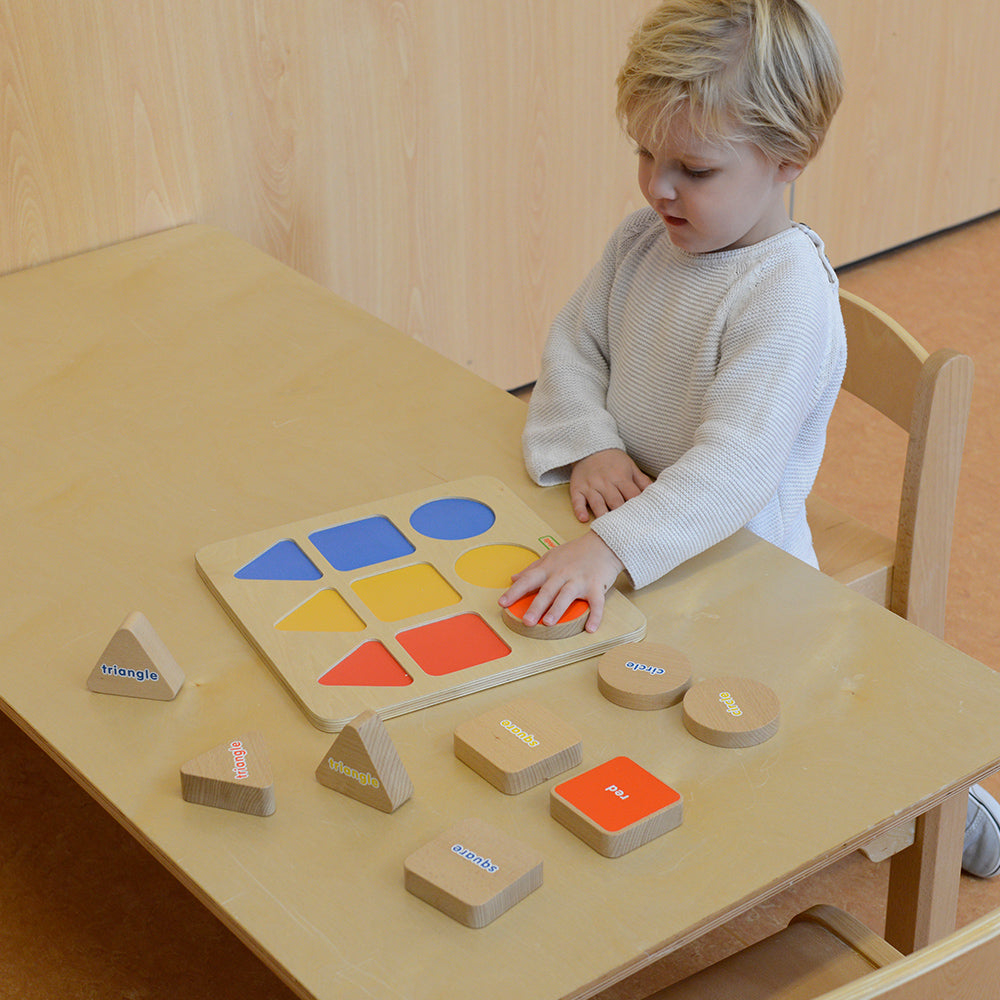 Fine motor skill development toy with geometric blocks