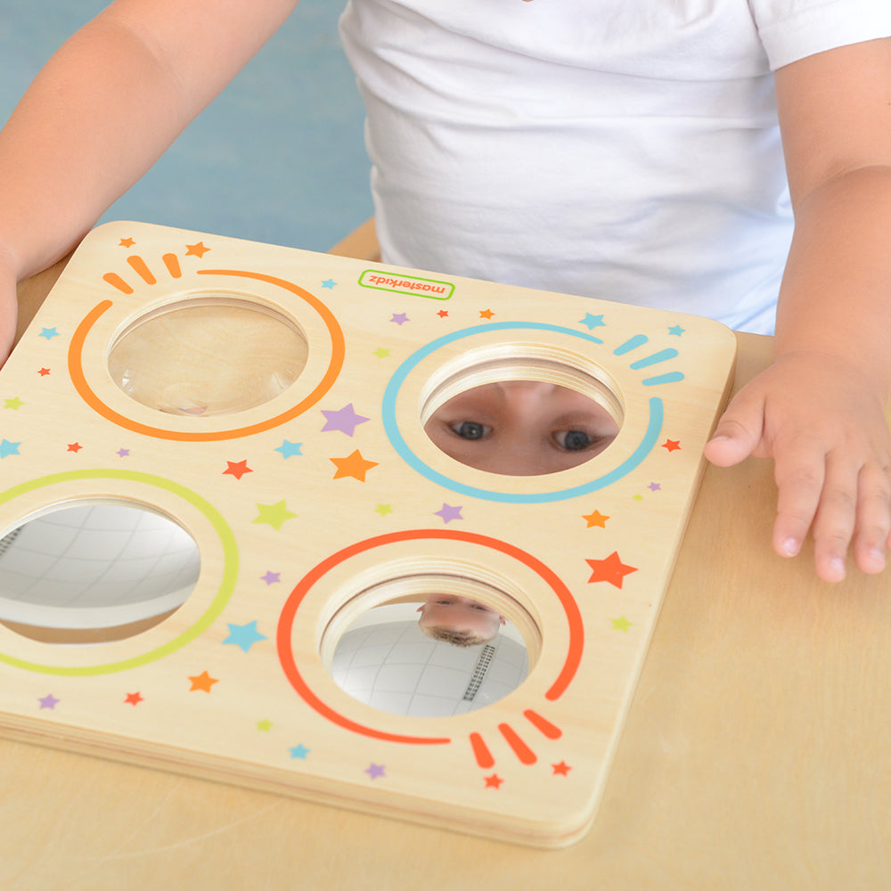 Parent guiding child through optical exploration activities.