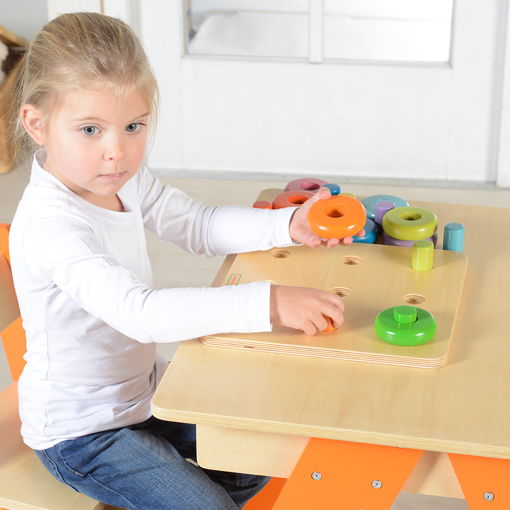 Montessori-style dowel matching board promoting color recognition and coordination.