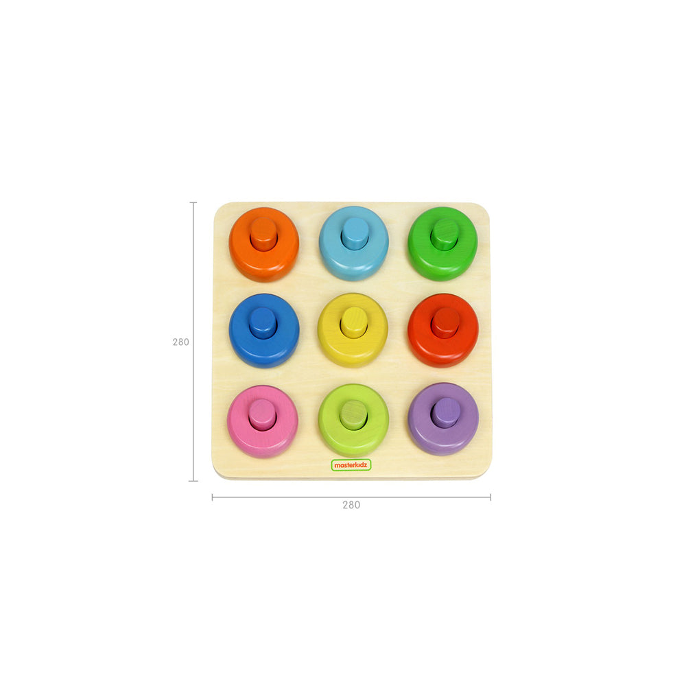 Toddler exploring creative play by stacking and arranging colorful dowels.