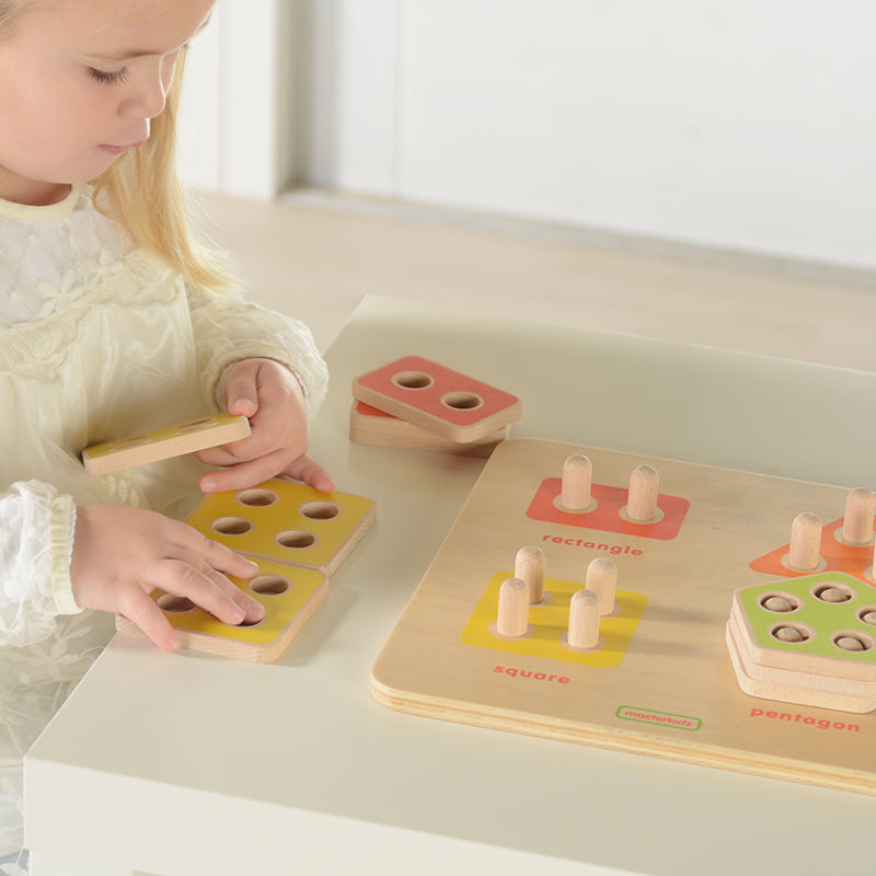 Close-up of eco-friendly Beech Wood geometric shapes in vibrant colors.