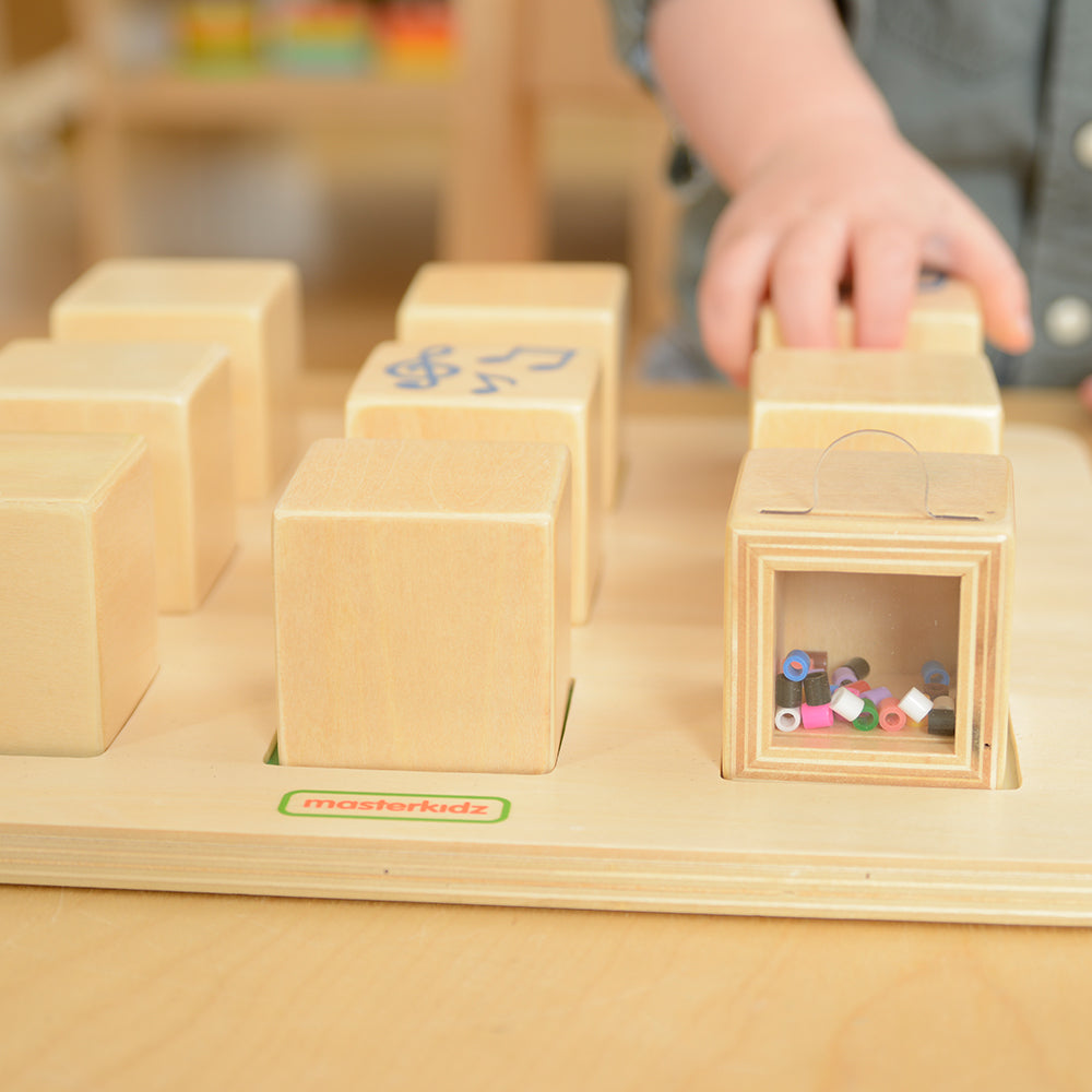 Close-up of the smooth, child-safe wooden material used in the sound cubes.
