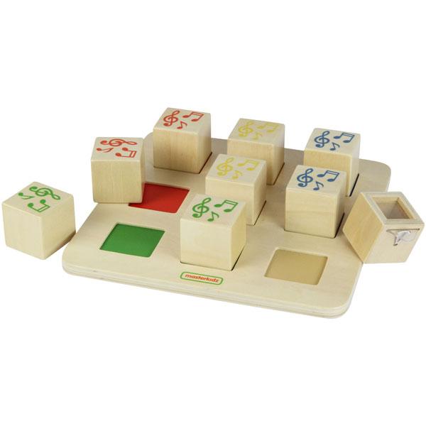 Flat lay display of four pairs of sound cubes for early childhood sensory education.