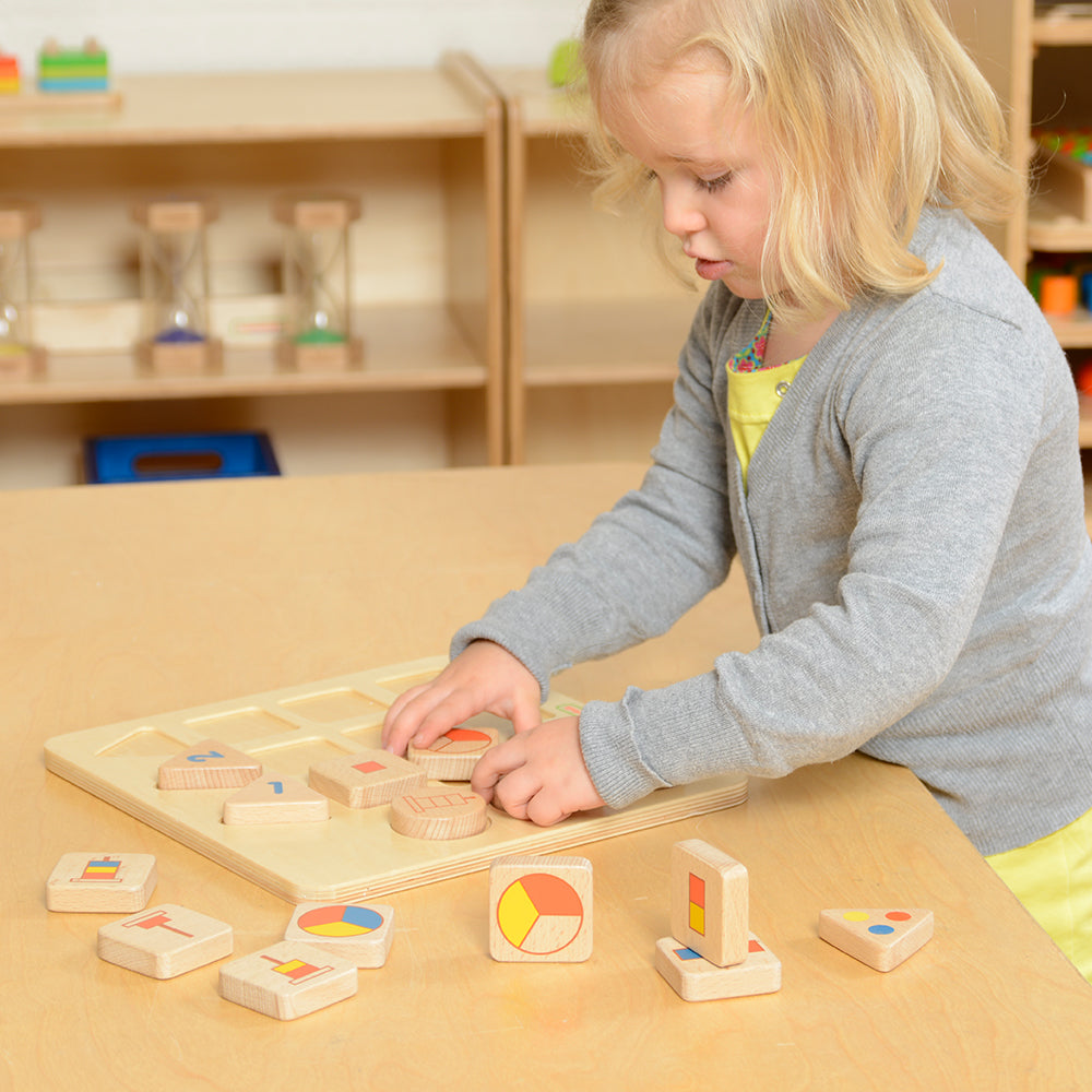 Child matching square tiles to the correct number symbols during learning play