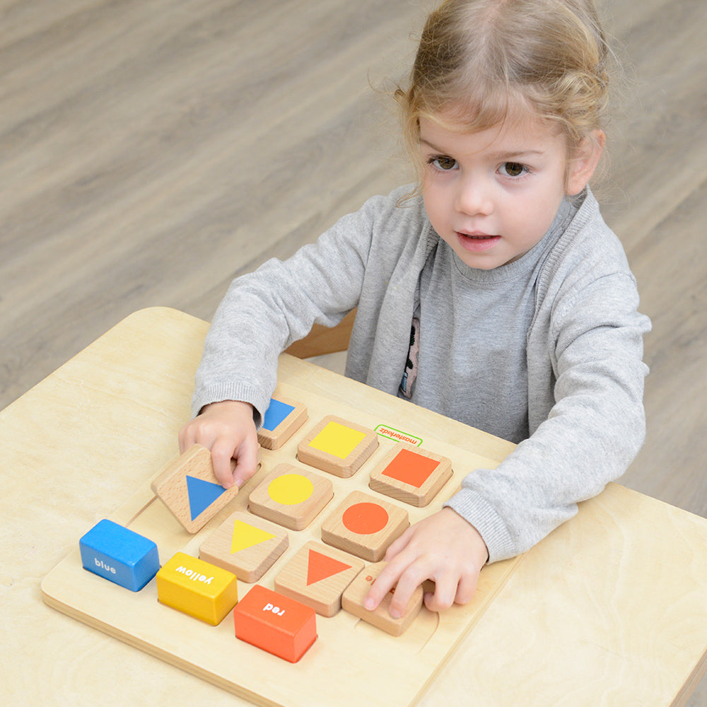 Montessori classroom scene with kids practising logical thinking and problem-solving skills.