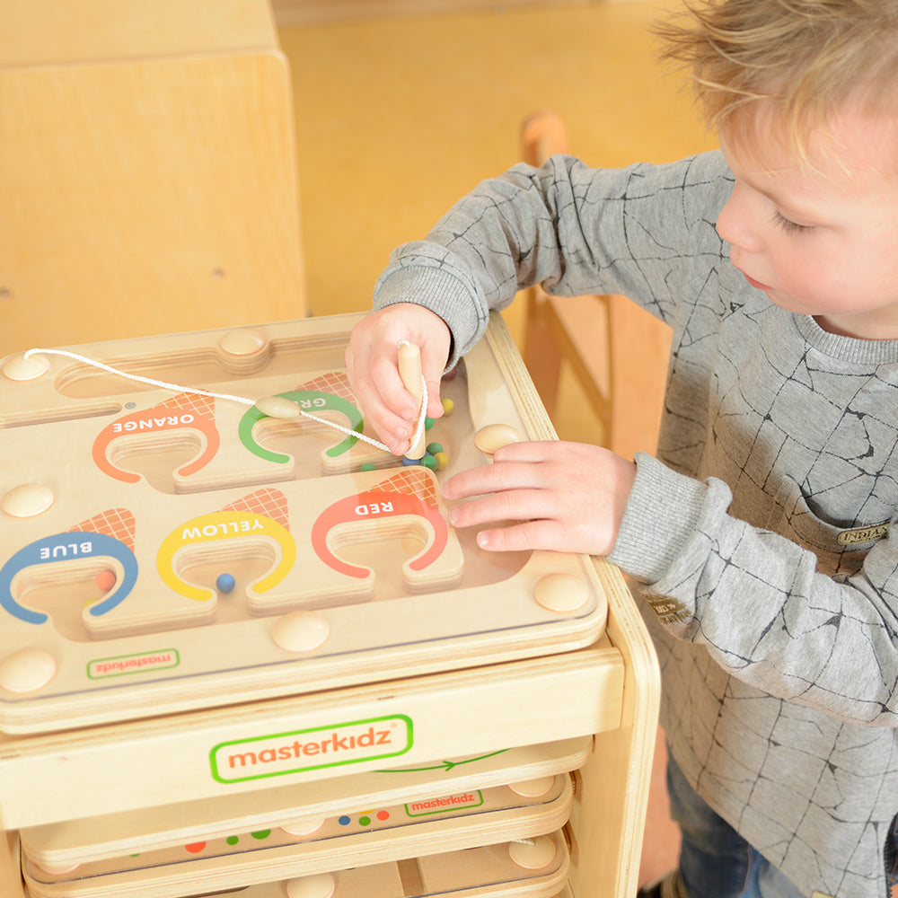 Home playroom setup for interactive colour learning and fine motor skill development.