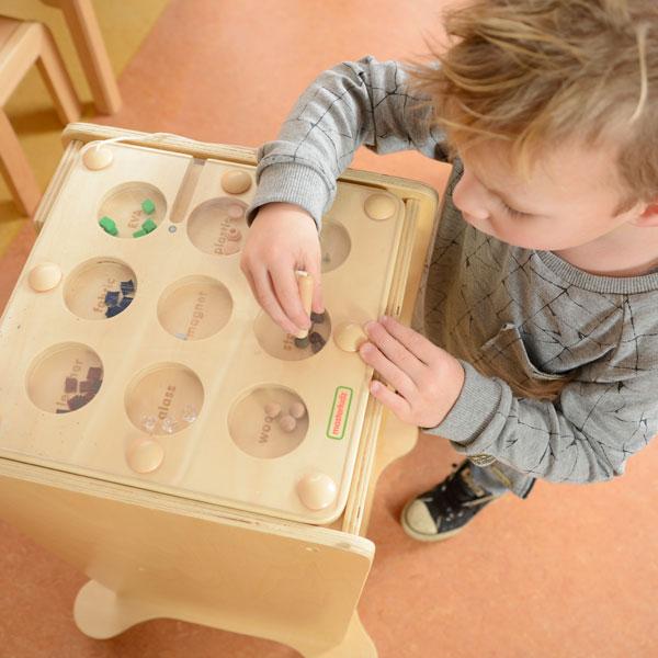 Close-up of smooth, durable wooden board with labelled material sections.