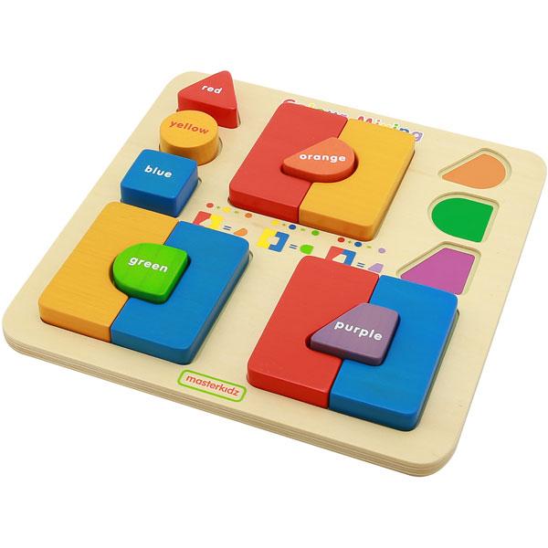 Blocks displayed on a wooden play table for interactive learning.