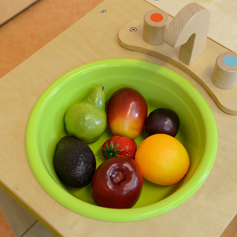 Toddlers role-playing with realistic wooden food toy set