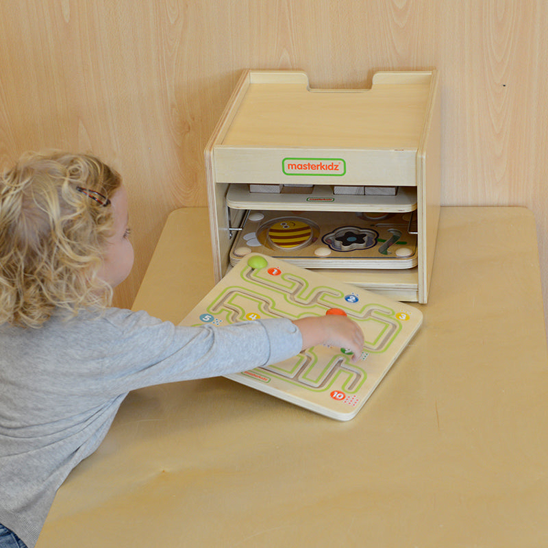 Masterkidz sliding maze used in a preschool learning environment.