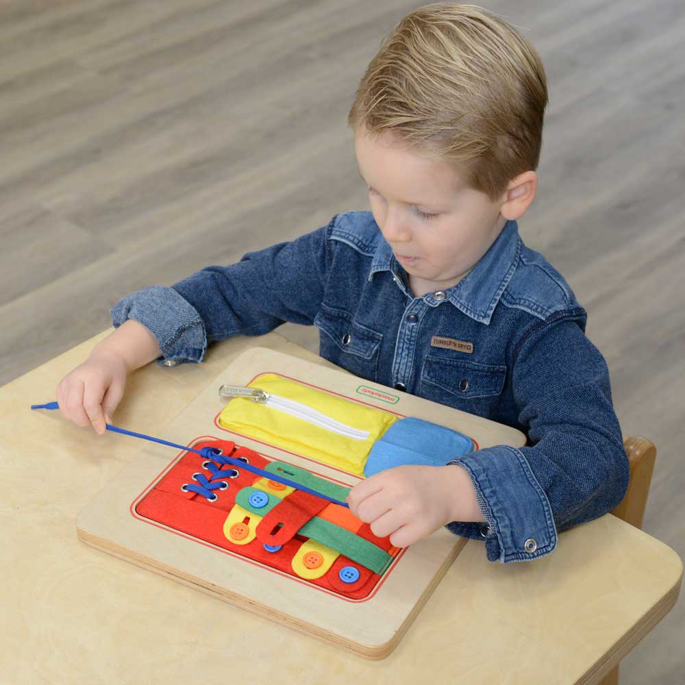 Preschool activity setup with the Masterkidz lacing and weaving board.