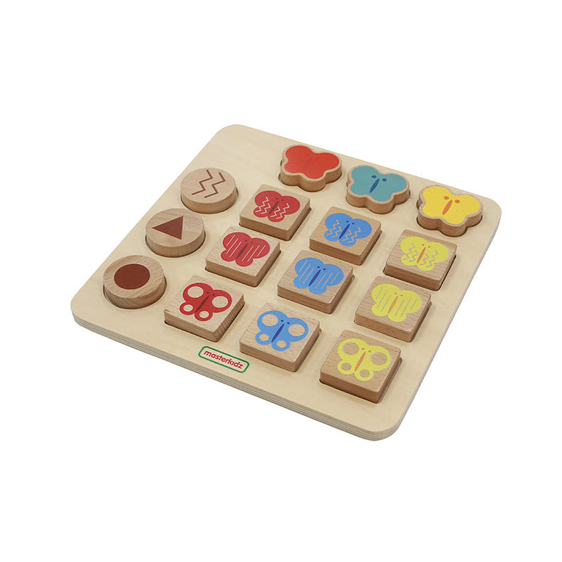 Kids practising pattern identification with butterfly and circle tiles.