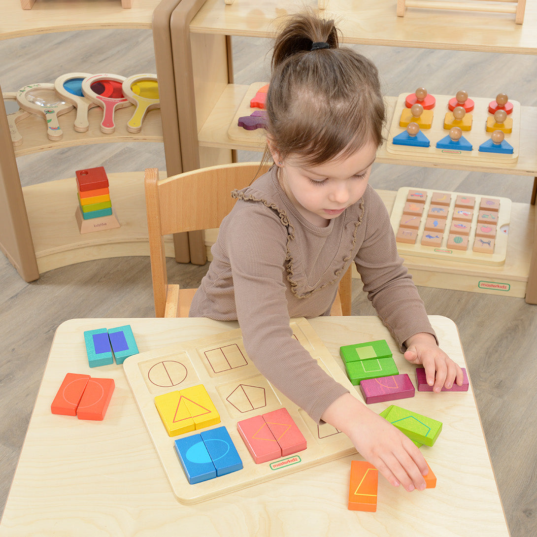 Children exploring shape decomposition with educational wooden board