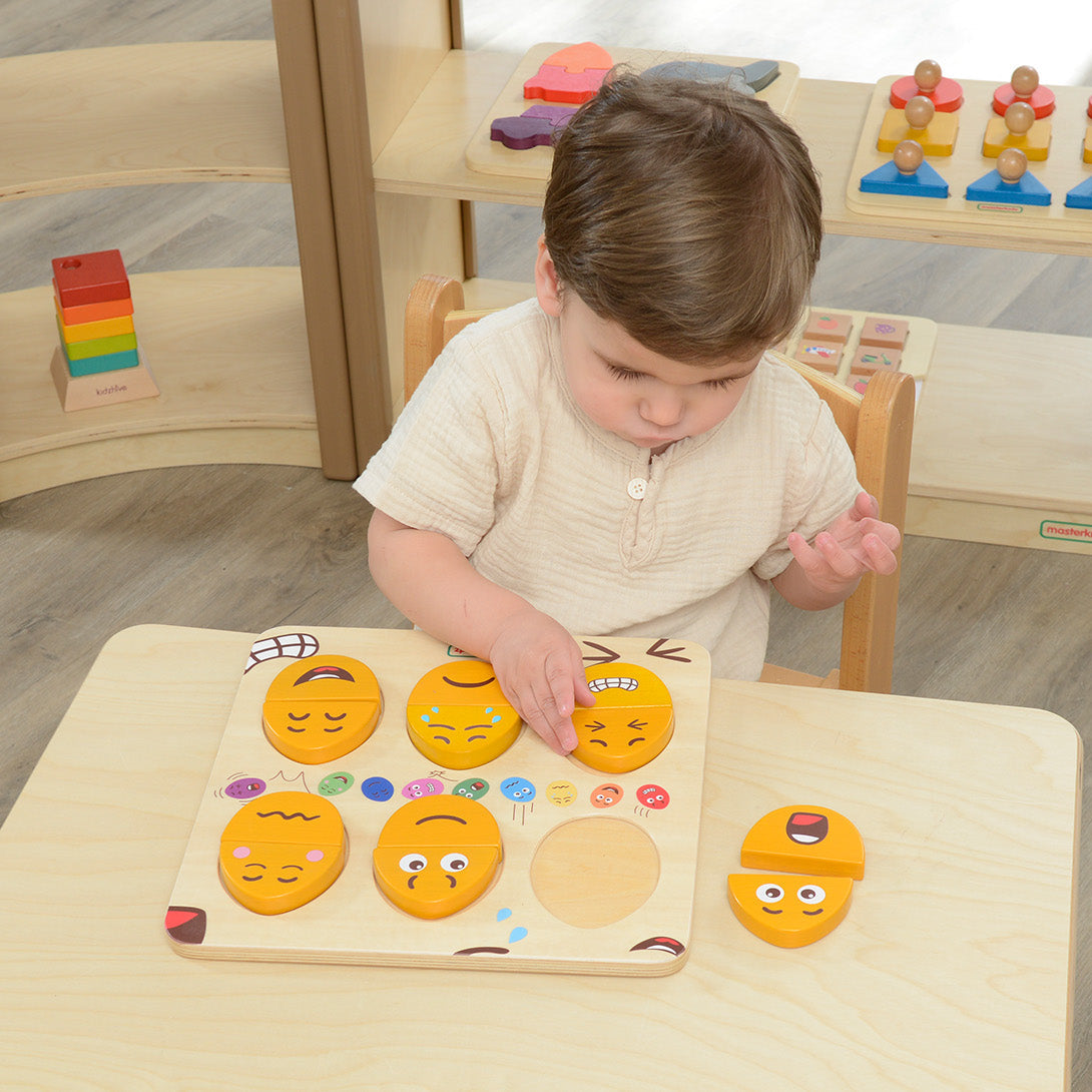 Wooden emotion learning board showing various mix-and-match egg expressions