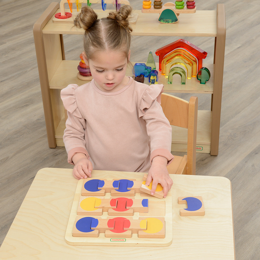 Children arranging colourful wooden tiles for pattern recognition