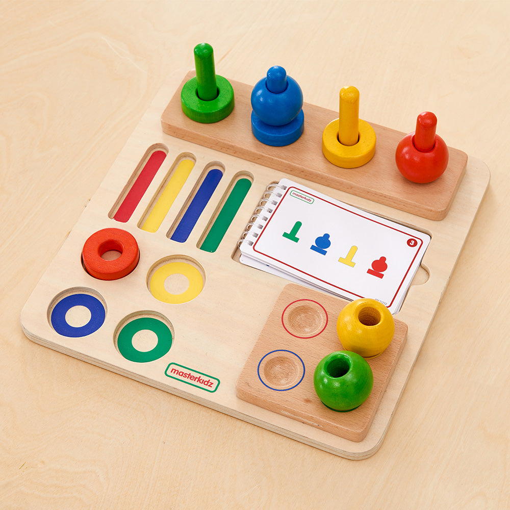 Close-up of a child’s hands practicing fine motor skills using a stacking peg.