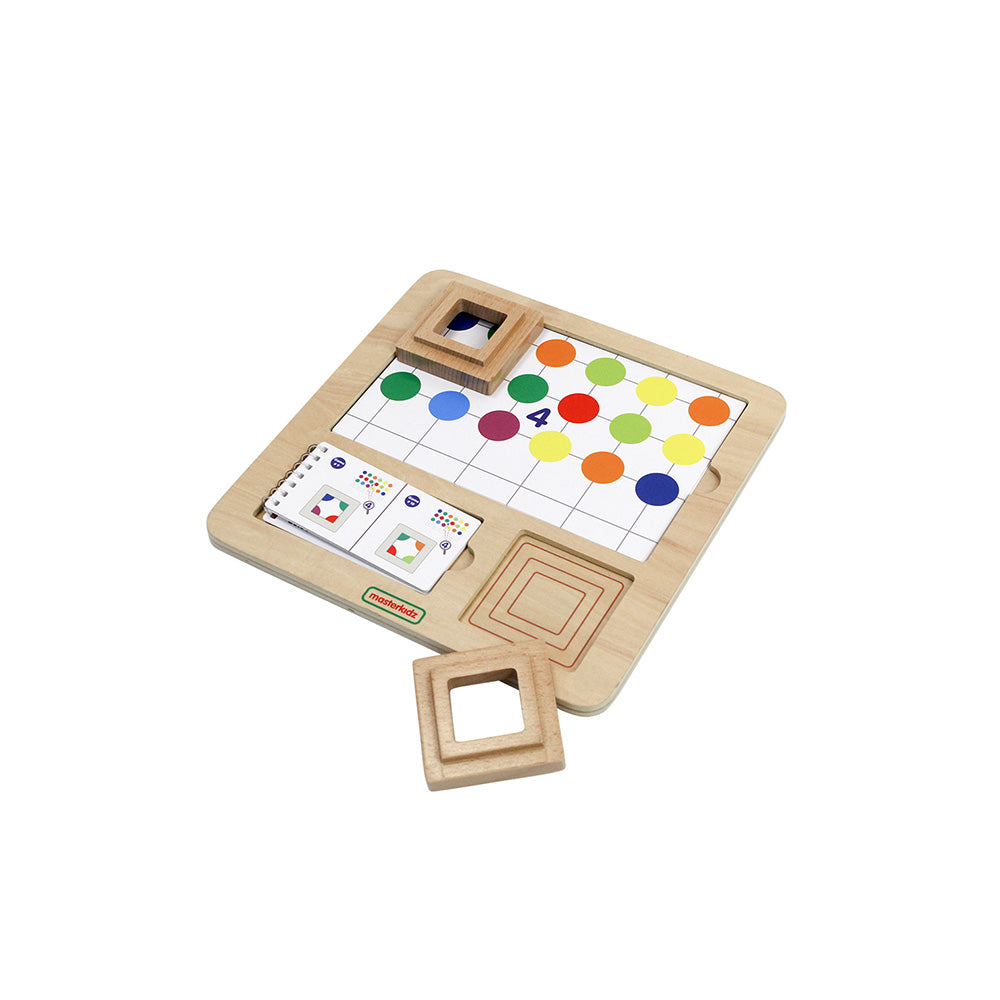 Child stacking rings and spheres to develop fine motor skills.