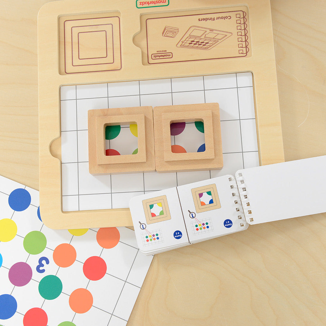 Preschool children playing with stacking shapes and colours.