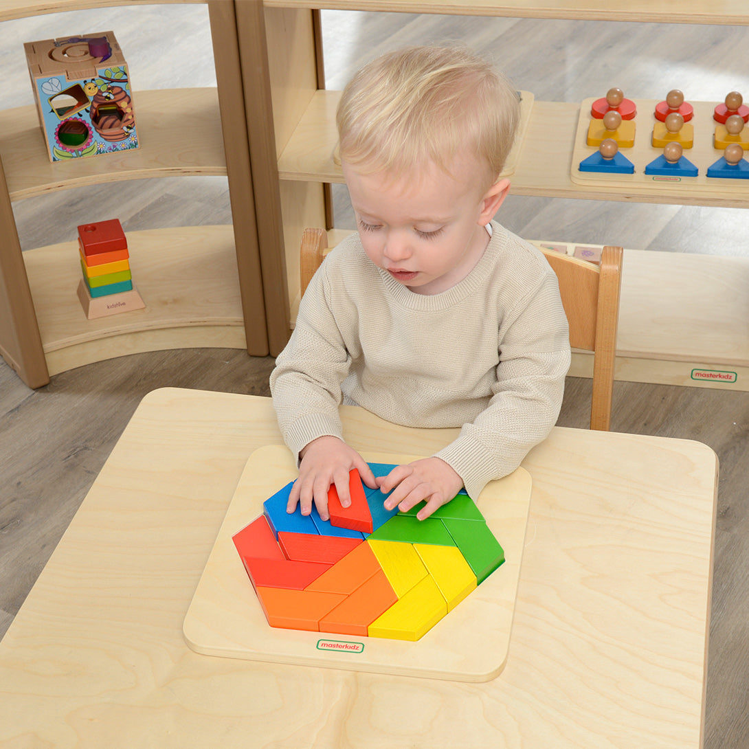Children using Masterkidz Windmill Tiles to build creative shapes.