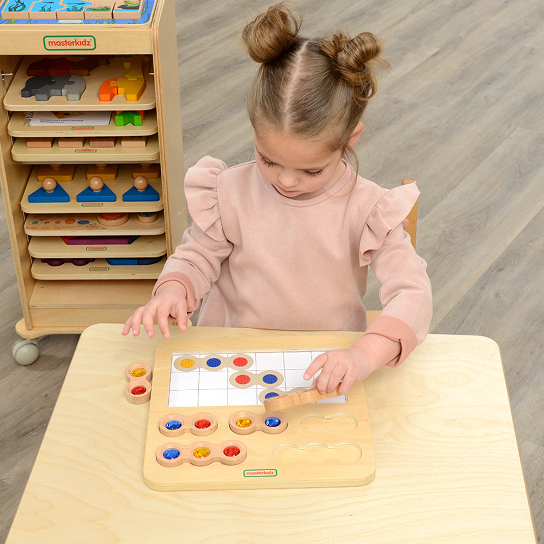 Early learning centre activity promoting pattern replication and logic skills.