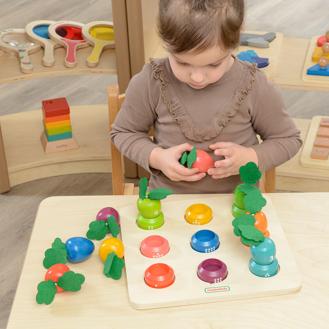 Kids learning numbers 1-9 with Masterkidz colourful carrot farm.