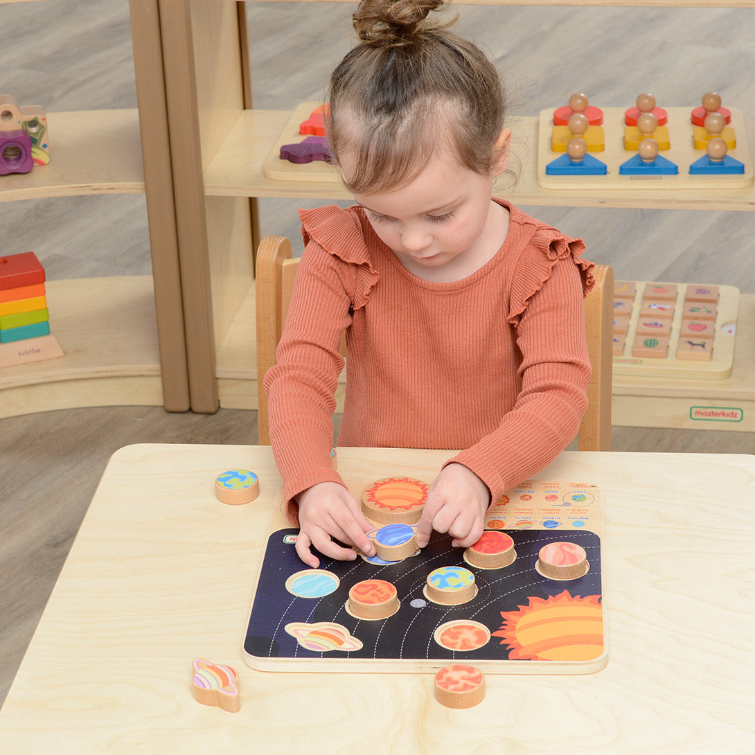 Children exploring the Solar System with Masterkidz wooden learning board, understanding planetary distances and space concepts