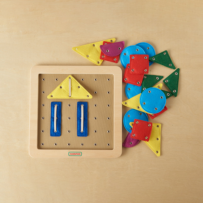 Preschool child threading shapes onto Masterkidz lacing board for pattern creation.