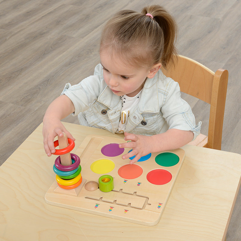 Kids playing with Masterkidz Ring Stacking Challenge Board to develop fine motor skills.