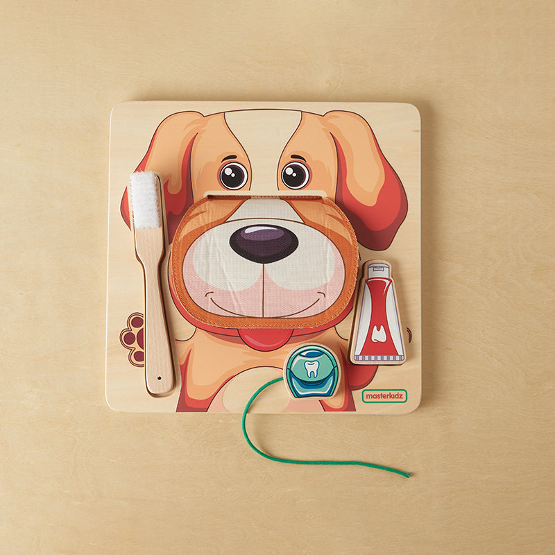 Children practicing brushing and flossing on Masterkidz oral health learning board.