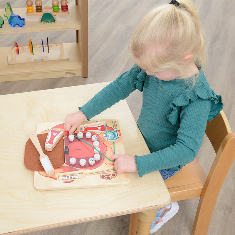 Masterkidz learning board encouraging kids to practice brushing and flossing for healthy teeth.