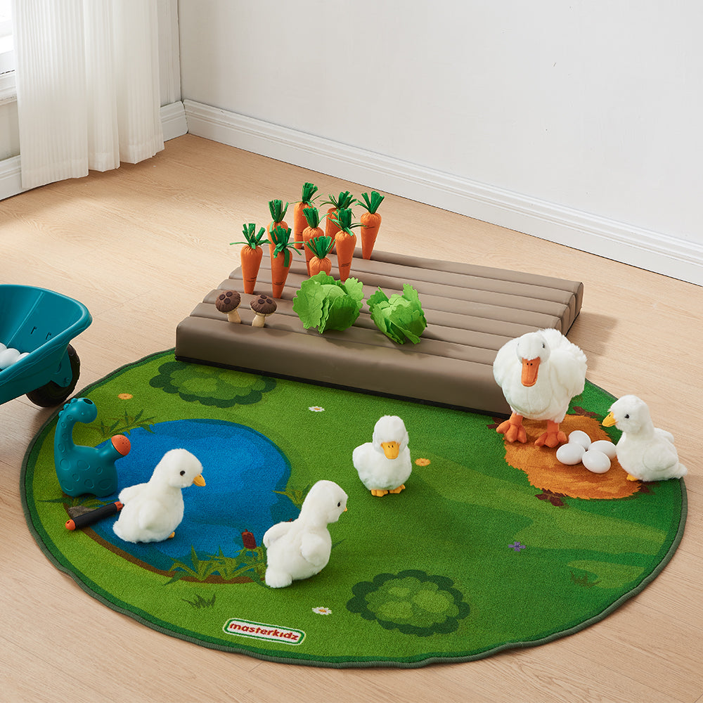 Child inserting a soft play carrot into the groove on the farm mat.